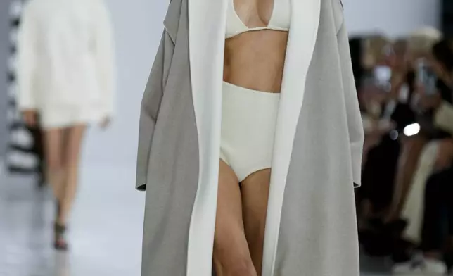 A model wears a creation as part of the Max Mara Spring Summer 2025 collection, that was presented in Milan, Italy, Thursday, Sept. 19, 2024. (AP Photo/Luca Bruno).