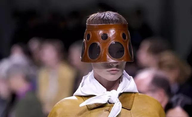 A model wears a creation as part of the Prada Spring Summer 2025 collection, that was presented in Milan, Italy, Thursday, Sept. 19, 2024. (AP Photo/Luca Bruno).