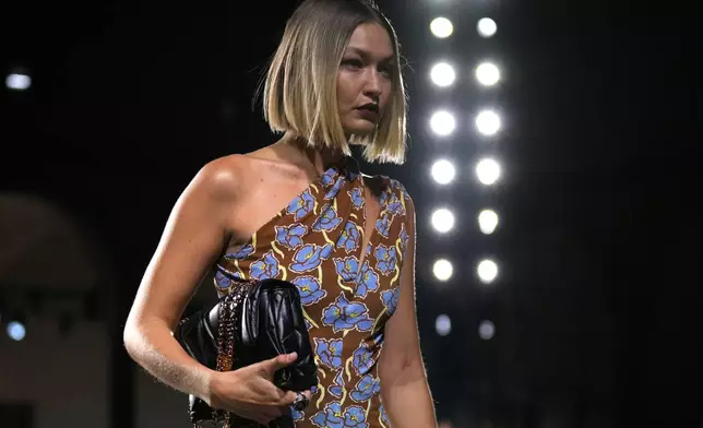 A model wears a creation as part of the Versace Spring Summer 2025 collection, that was presented in Milan, Italy, Friday, Sept. 20, 2024. (AP Photo/Antonio Calanni)