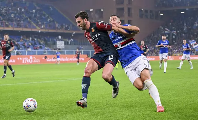 Genoa's Mattia Bani, left, shields the ball from Sampdoria's Massimo Coda during an Italian Cup soccer match between Genoa and Sampdoria at Luigi Ferraris Stadium, Wednesday, Sept. 25, 2024, in Genoa, Italy. (Tano Pecoraro/LaPresse via AP)