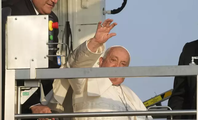 Pope Francis arrives at Fiumicino International airport Leonardo da Vinci, some 30 kilometers south-west of Rome, Thursday, Sept. 26, 2024 to board the papal flight to Luxembourg for a four-day visit to Luxembourg and Belgium. (AP Photo/Gregorio Borgia)