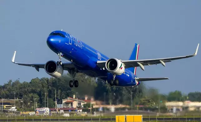 The ITA Airways ITY4000 papal plane with Pope Francis and bound to Luxembourg, where the pope will start his four-day visit to Luxembourg and Belgium, takes off from the Fiumicino International airport Leonardo da Vinci, some 30 kilometers south-west of Rome, Thursday, Sept. 26, 2024. (AP Photo/Gregorio Borgia)