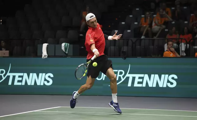 Belgium's Raphael Collignon plays Netherlands' Botic Van De Zandschulp during their Davis Cup tennis match at the Unipol Arena in Casalecchio di Reno, near Bologna, Italy, Tuesday, Sept. 10, 2024. (Michele Nucci/LaPresse via AP)