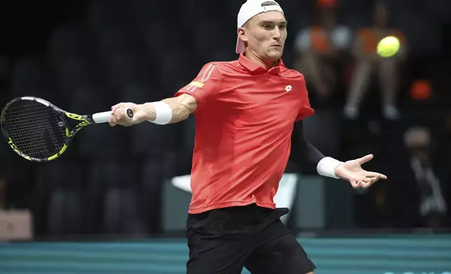 Belgium's Raphael Collignon plays Netherlands' Botic Van De Zandschulp during their Davis Cup tennis match at the Unipol Arena in Casalecchio di Reno, near Bologna, Italy, Tuesday, Sept. 10, 2024. (Michele Nucci/LaPresse via AP)