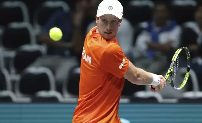 Netherlands' Botic Van De Zandschulp plays Belgium's Raphael Collignon during their Davis Cup tennis match at the Unipol Arena in Casalecchio di Reno, near Bologna, Italy, Tuesday, Sept. 10, 2024. (Michele Nucci/LaPresse via AP)