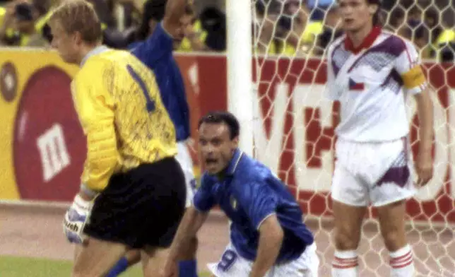 FILE - Italian forward Salvatore "Totò" Schillaci, center, celebrates after scoring the first goal for Italy in the World Cup game against Czechoslovakia, in Rome, Italy, June 19, 1990. (AP Photo/Martin Cleaver, file)