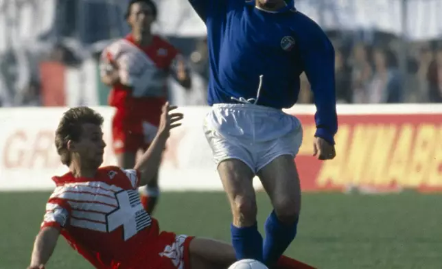 Italy Salvatore "Totò" Schillaci, right, controls the ball during a World Cup soccer match between Italy and Austria, in Rome, on June 9, 1990. (LaPresse via AP)