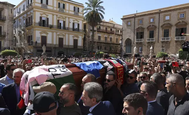 Pallbearers carry the coffin of Italian World Cup hero Salvatore Toto' Schillaci, during his funeral ceremony at the Palermo cathedral, Italy, Friday, Sept. 20, 2024. (Alberto Lo Bianco/LaPresse via AP)