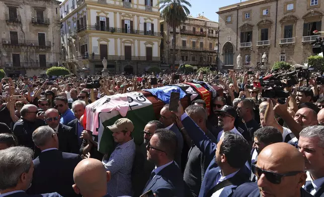 Pallbearers carry the coffin of Italian World Cup hero Salvatore Toto' Schillaci, during his funeral ceremony at the Palermo cathedral, Italy, Friday, Sept. 20, 2024. (Alberto Lo Bianco/LaPresse via AP)