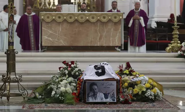 The coffin of Italian World Cup hero Salvatore Toto' Schillaci, during his funeral ceremony at the Palermo cathedral, Italy, Friday, Sept. 20, 2024. (Alberto Lo Bianco/LaPresse via AP)