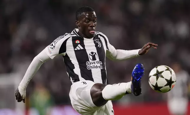 Juventus' Timothy Weah reaches for the ball during the Champions League opening phase soccer match between Juventus and PSV Eindhoven at the Juventus stadium in Turin, Italy, Tuesday, Sept. 17, 2024. (Fabio Ferrari/LaPresse via AP)