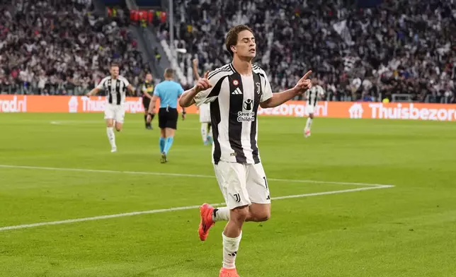 Juventus' Kenan Yildiz celebrates after scoring the opening goal during the Champions League opening phase soccer match between Juventus and PSV Eindhoven at the Juventus stadium in Turin, Italy, Tuesday, Sept. 17, 2024. (Fabio Ferrari/LaPresse via AP)