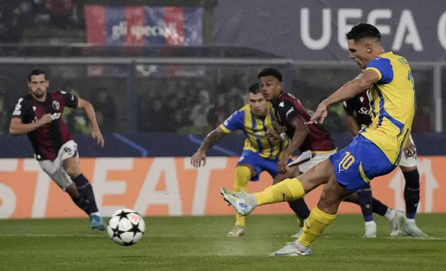 Shakhtar Donetsk's Georgiy Sudakov, front, misses a penalty kick during the Champions League opening phase soccer match between FC Bologna and Shakhtar Donetsk in Bologna, Italy, Wednesday, Sept. 18, 2024. (Massimo Paolone/LaPresse via AP)