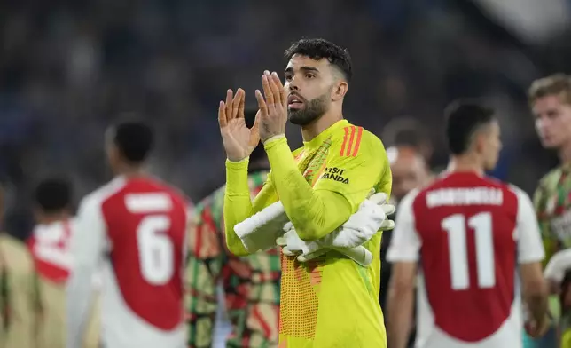 Arsenal's goalkeeper David Raya applauds after the Champions League opening phase soccer match between Atalanta and Arsenal at the Bergamo's stadium in Bergamo, Italy, Thursday, Sept. 19, 2024. (AP Photo/Antonio Calanni)