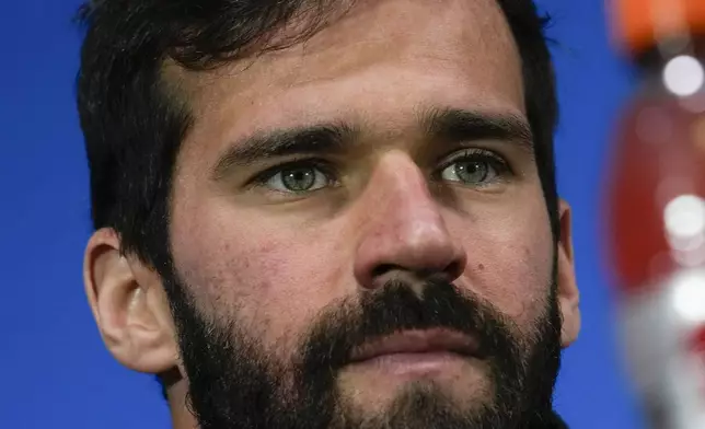 Liverpool's goalkeeper Alisson Becker attends a news conference at the San Siro Stadium, in Milan, Italy, Monday, Sept.16, 2024, ahead of Champions League soccer match between A.C. Milan and Liverpool on Tuesday. (AP Photo/Luca Bruno)