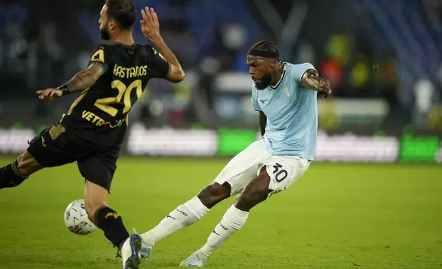 Verona's Grigoris Kastanos, left, tries to block a shot from Lazio's Nuno Tavares during a Serie A soccer match between Lazio and Hellas Verona, at Rome's Stadio Olimpico, Monday, Sept. 16, 2024. (AP Photo/Andrew Medichini)