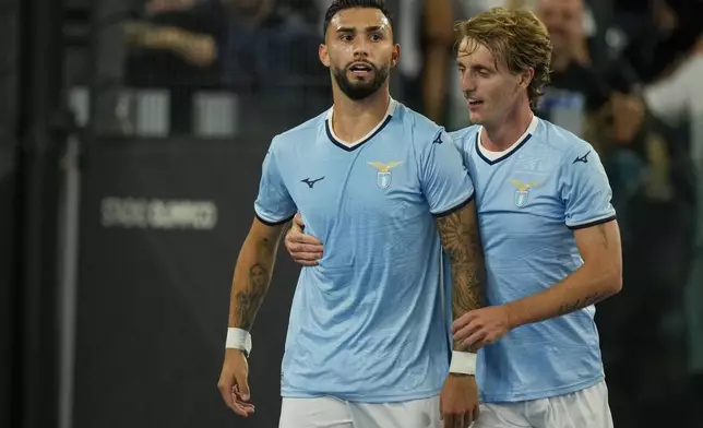 Lazio's Taty Castellanos, left, celebrates with Lazio's Nicolo Rovella after scoring his side's second goal during a Serie A soccer match between Lazio and Hellas Verona, at Rome's Stadio Olimpico, Monday, Sept. 16, 2024. (AP Photo/Andrew Medichini)