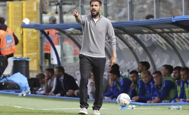 Como's head coach Cesc Fabregas gives instructions during the Italian Serie A soccer match between Como and Bologna at the Giuseppe Sinigaglia stadium in Como, Italy, Saturday, Sept. 14, 2024. (Antonio Saia/LaPresse via AP)