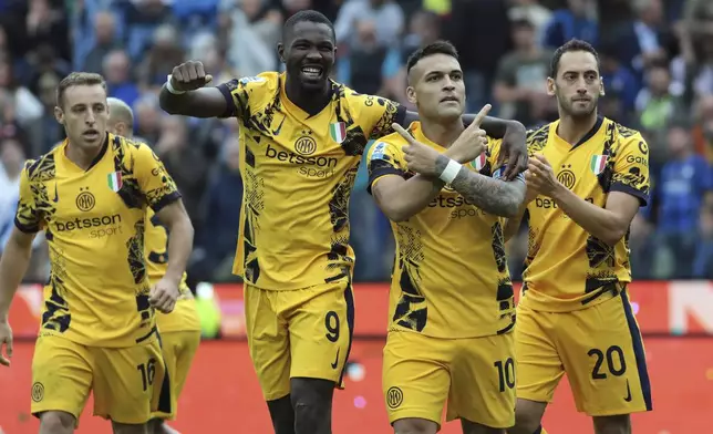 Inter Milan's Lautaro Martinez, second from right, celebrates after scoring during the Serie A soccer match between Udinese and Inter, at the Bluenergy Stadium in Udine, Italy, Saturday, Sept. 28, 2024. (Andrea Bressanutti/LaPresse via AP)