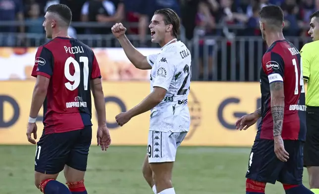 Empoli's Lorenzo Colombo, center, celebrates after scoring his side's opening goal during the Italian Serie A soccer match between Cagliari and Empoli at the Unipol Domus in Cagliari, Italy, Friday, Friday, Sept. 20, 2024. (Gianluca Zuddas/LaPresse via AP)