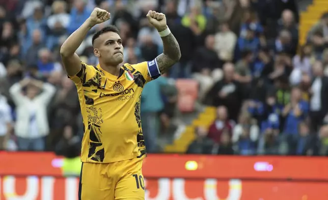 Inter Milan's Lautaro Martinez celebrates after scoring during the Serie A soccer match between Udinese and Inter, at the Bluenergy Stadium in Udine, Italy, Saturday, Sept. 28, 2024. (Andrea Bressanutti/LaPresse via AP)