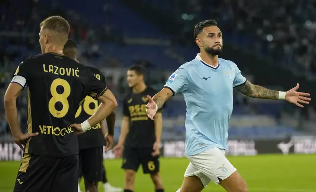 Lazio's Taty Castellanos, right, celebrates after scoring his side's second goal during a Serie A soccer match between Lazio and Hellas Verona, at Rome's Stadio Olimpico, Monday, Sept. 16, 2024. (AP Photo/Andrew Medichini)