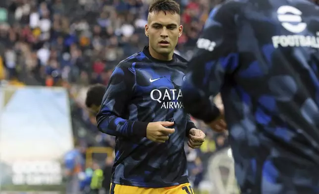 Inter Milan's Lautaro Martinez warms up prior to the Serie A soccer match between Udinese and Inter, at the Bluenergy Stadium in Udine, Italy, Saturday, Sept. 28, 2024. (Andrea Bressanutti/LaPresse via AP)