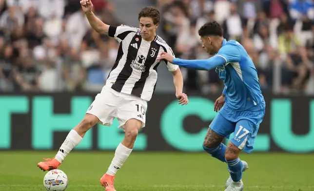 Juventus' Kenan Yildiz, left, and Napoli's Mathias Olivera, right, challenge for the ball during the Serie A soccer match between Juventus FC and SSC Napoli in Turin, Italy, Saturday, Sept. 21, 2024. (Fabio Ferrari/LaPresse)