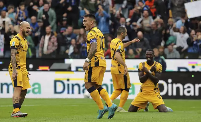 Inter Milan's Lautaro Martinez celebrates after scoring during the Serie A soccer match between Udinese and Inter, at the Bluenergy Stadium in Udine, Italy, Saturday, Sept. 28, 2024. (Andrea Bressanutti/LaPresse via AP)