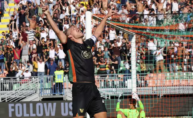 Venezia's Joel Pohjanpalo celebrates scoring during the Serie A soccer match between Venezia and Genoa at the Pier Luigi Penzo Stadium, Italy, Saturday Sept. 21, 2024. (Paola Garbuio/LaPresse via AP)