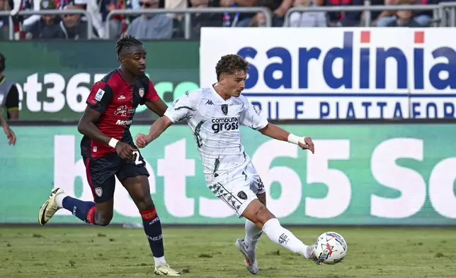 Empoli's Sebastiano Esposito kicks the ball during the Italian Serie A soccer match between Cagliari and Empoli at the Unipol Domus in Cagliari, Italy, Friday, Friday, Sept. 20, 2024. (Gianluca Zuddas/LaPresse via AP)