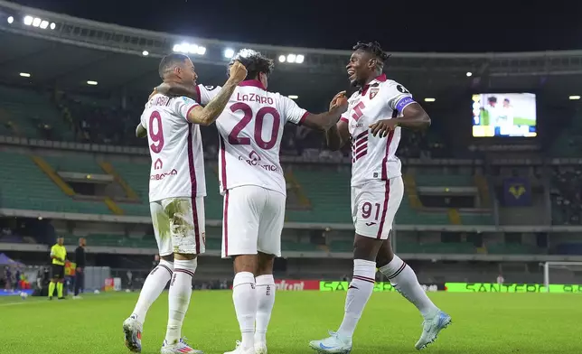 Torino's Antonio Sanabria, left, celebrates scoring with teammates during the Serie A soccer match between Hellas Verona and Torino at the Bentegodi Stadium in Verona, Italy, Friday Sept. 20, 2024. (Spada/LaPresse via AP)