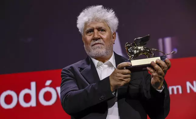 Pedro Almodovar, winner of the golden lion for best film for 'The Room Next Door', poses for photographers during the awards ceremony of the 81st edition of the Venice Film Festival in Venice, Italy, on Saturday, Sept. 7, 2024. (Photo by Joel C Ryan/Invision/AP)