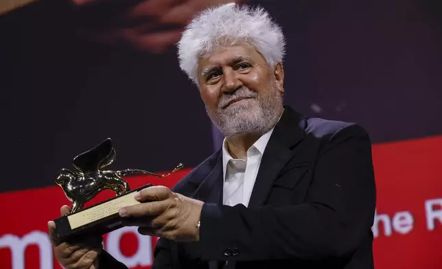 Pedro Almodovar, winner of the golden lion for best film for 'The Room Next Door', poses for photographers during the awards ceremony of the 81st edition of the Venice Film Festival in Venice, Italy, on Saturday, Sept. 7, 2024. (Photo by Joel C Ryan/Invision/AP)