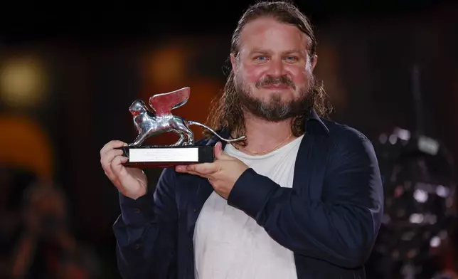 Brady Corbet, winner of the silver lion for best director for the film 'The Brutalist', poses for photographers at the awards photo call during the closing ceremony of the 81st edition of the Venice Film Festival in Venice, Italy, on Saturday, Sept. 7, 2024. (Photo by Vianney Le Caer/Invision/AP)