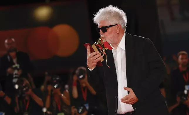 Pedro Almodovar, winner of the golden lion for best film for 'The Room Next Door', poses for photographers at the awards photo call during the closing ceremony of the 81st edition of the Venice Film Festival in Venice, Italy, on Saturday, Sept. 7, 2024. (Photo by Vianney Le Caer/Invision/AP)