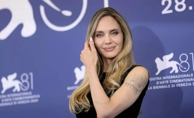 Angelina Jolie poses for photographers at the photo call for the film 'Maria' during the 81st edition of the Venice Film Festival in Venice, Italy, on Thursday, Aug. 29, 2024. (Photo by Vianney Le Caer/Invision/AP)