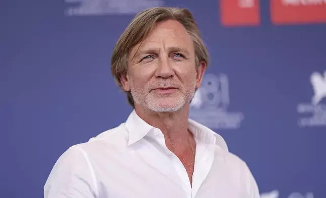 Daniel Craig poses for photographers at the photo call for the film 'Queer' during the 81st edition of the Venice Film Festival in Venice, Italy, on Tuesday, Sept. 3, 2024. (Photo by Vianney Le Caer/Invision/AP)