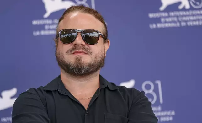 Director Brady Corbet poses for photographers at the photo call for the film 'The Brutalist' during the 81st edition of the Venice Film Festival in Venice, Italy, on Sunday, Sept. 1, 2024. (Photo by Vianney Le Caer/Invision/AP)