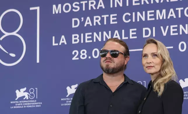 Director Brady Corbet, left, and writer Mona Fastvold pose for photographers at the photo call for the film 'The Brutalist' during the 81st edition of the Venice Film Festival in Venice, Italy, on Sunday, Sept. 1, 2024. (Photo by Vianney Le Caer/Invision/AP)