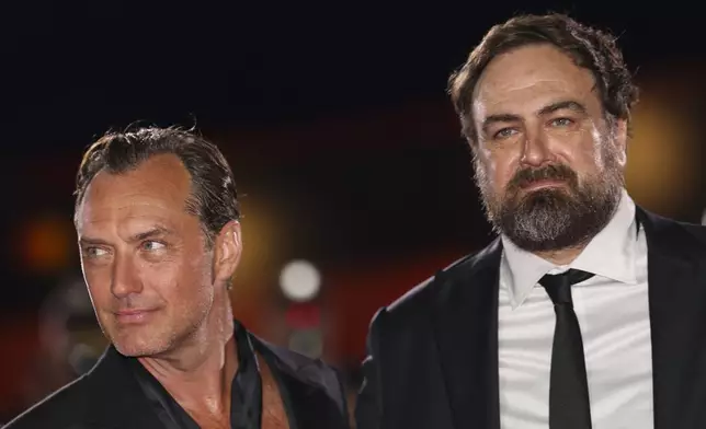 Jude Law, left, and director Justin Kurzel pose for photographers upon arrival for the premiere of the film 'The Order' during the 81st edition of the Venice Film Festival in Venice, Italy, on Saturday, Aug. 31, 2024. (Photo by Vianney Le Caer/Invision/AP)