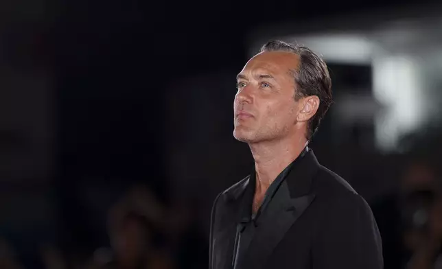 Jude Law poses for photographers upon arrival for the premiere of the film 'The Order' during the 81st edition of the Venice Film Festival in Venice, Italy, on Saturday, Aug. 31, 2024. (Photo by Vianney Le Caer/Invision/AP)