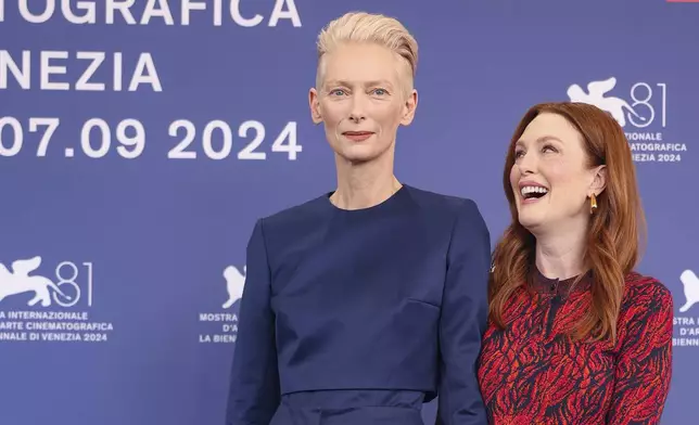 Tilda Swinton, left, and Julianne Moore pose for photographers at the photo call for the film 'The Room Next Door' during the 81st edition of the Venice Film Festival in Venice, Italy, on Monday, Sept. 2, 2024. (Photo by Vianney Le Caer/Invision/AP)