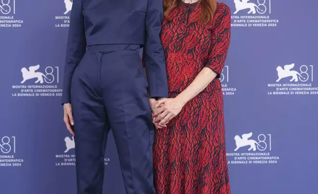 Tilda Swinton, left, and Julianne Moore pose for photographers at the photo call for the film 'The Room Next Door' during the 81st edition of the Venice Film Festival in Venice, Italy, on Monday, Sept. 2, 2024. (Photo by Vianney Le Caer/Invision/AP)