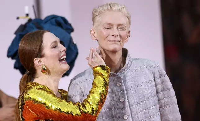 Julianne Moore, left, and Tilda Swinton pose for photographers upon arrival for the premiere of the film 'The Room Next Door' during the 81st edition of the Venice Film Festival in Venice, Italy, on Monday, Sept. 2, 2024. (Photo by Vianney Le Caer/Invision/AP)