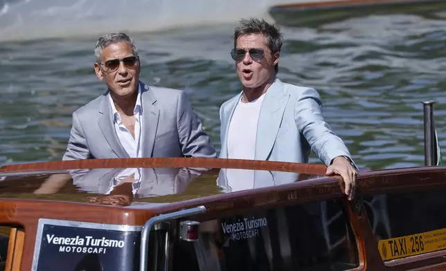 George Clooney, left, and Brad Pitt upon arrival for the press conference of the film 'Wolfs' during the 81st edition of the Venice Film Festival in Venice, Italy, on Sunday, Sept. 1, 2024. (Photo by Joel C Ryan/Invision/AP)