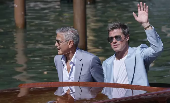 George Clooney, left, and Brad Pitt upon arrival for the press conference of the film 'Wolfs' during the 81st edition of the Venice Film Festival in Venice, Italy, on Sunday, Sept. 1, 2024. (Photo by Joel C Ryan/Invision/AP)