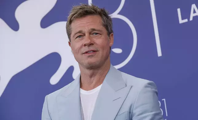 Brad Pitt poses for photographers at the photo call for the film 'Wolfs' during the 81st edition of the Venice Film Festival in Venice, Italy, on Sunday, Sept. 1, 2024. (Photo by Joel C Ryan/Invision/AP)