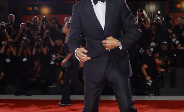 George Clooney poses for photographers upon arrival for the premiere of the film 'Wolfs' during the 81st edition of the Venice Film Festival in Venice, Italy, on Sunday, Sept. 1, 2024. (Photo by Joel C Ryan/Invision/AP)