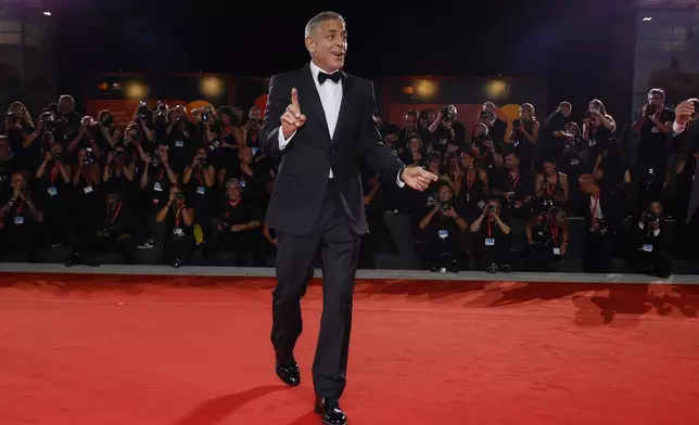 George Clooney poses for photographers upon arrival for the premiere of the film 'Wolfs' during the 81st edition of the Venice Film Festival in Venice, Italy, on Sunday, Sept. 1, 2024. (Photo by Joel C Ryan/Invision/AP)